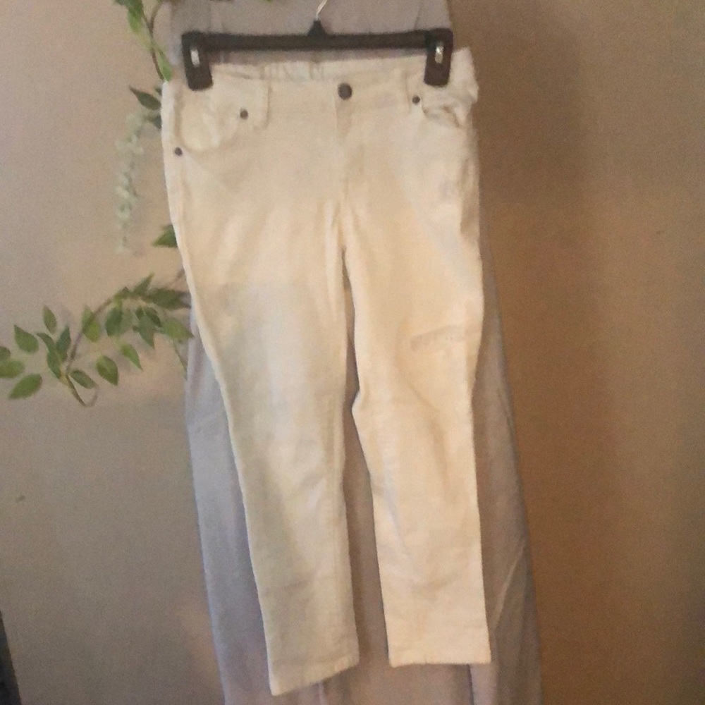 Size 12 white jeans with torn patches (style)